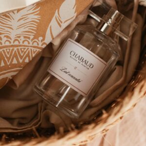 Close-up of Chabaud perfume bottle in a wicker basket with elegant packaging.